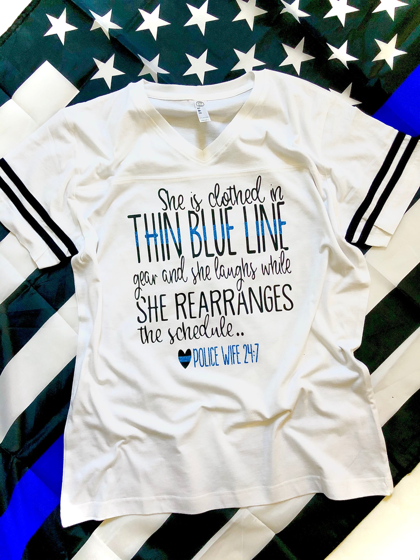 She is clothed in thin blue line gear - police wife